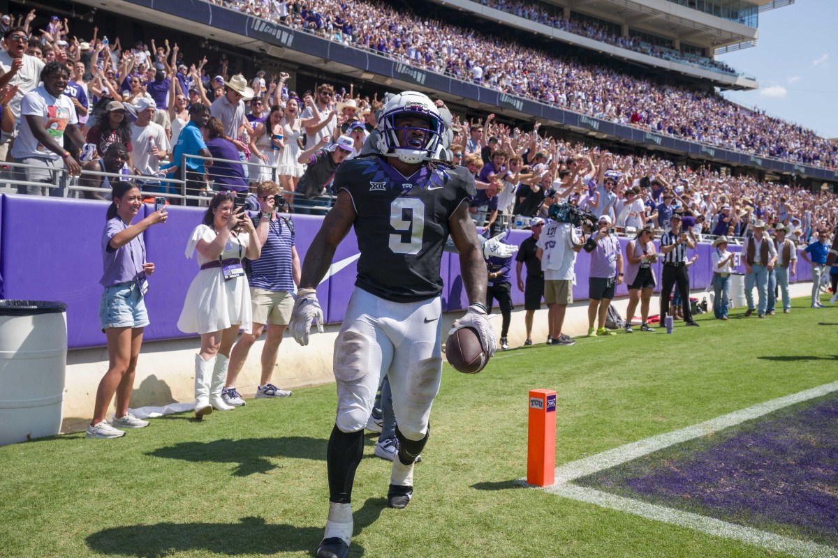TCU Horned Frogs running back Emani Bailey (9) celebrates after he runs for a touchdown against the SMU Mustangs during the second half at Amon G. Carter Stadium.